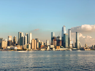 Fototapeta premium New York City skyline during sunset with its high buildings and clear sky