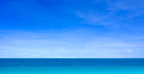 Nature of the beach and sea Summer with sunshine, sandy beaches, clear blue waters sparkling against the blue sky. On an island with good ecology and environment Background for summer vacation