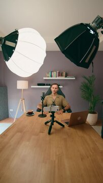 For media content at home, prepare microphone, camera, lights, and laptop in a studio setup