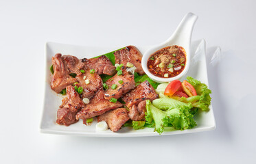 Grilled beef tongue served with a spicy Thai dipping sauce (cayenne pepper, roasted rice, chopped...