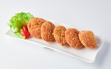 Shrimp Donut (Shrimp coated in flour and bread crumbs fried in oil) served on white plate isolated on white background.