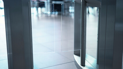 Man passing through the security gates. Media. Man using turnstile to enter the shopping center or...