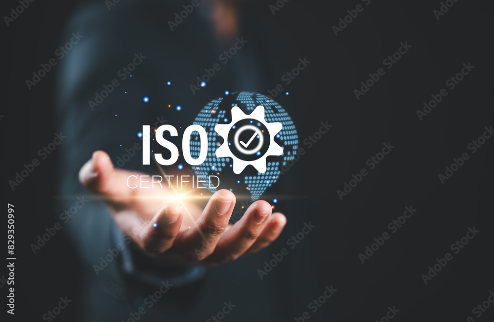 Poster iso standards quality control. businessman hold virtual globe with quality assurance or guarantee pr