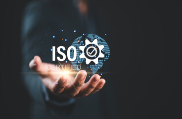 ISO standards quality control. Businessman hold virtual globe with quality assurance or guarantee product. ISO Standard certification. Modern ISO banner.