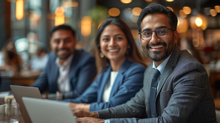 Indian business team working together in office.	