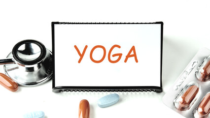 Yoga title on a white business card on a stand on a white background.