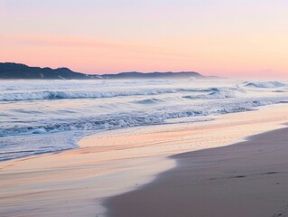 Obraz premium A serene beach scene at dawn with soft waves gently lapping the shore and a colorful sunrise in the background