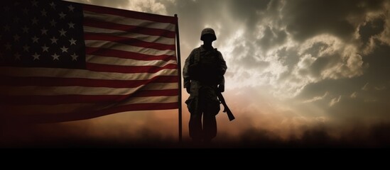 Fototapeta premium silhouette of soldier and american flag