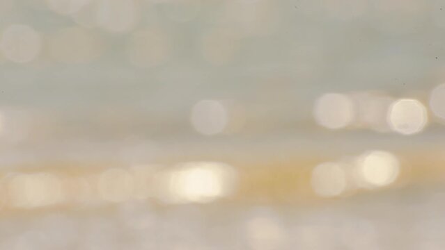 Blurred background golden glitter shiny sparkling banner. Glitter digital light blur bokeh glow soft backdrop effect. Gold bokeh template for digital presentation slideshow background desgn element