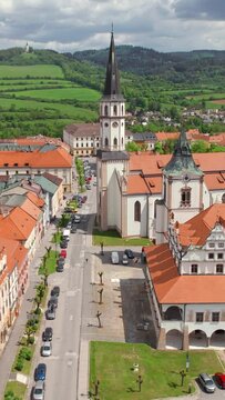 Aerial view of the historic center of Levoca town in summer, Slovakia. City hall, Basillica of St. James and other historic buildings in Levoca, Slovakia. Drone forward dolly