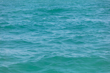 Blue water in the sea as an abstract background. Texture