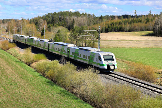 Pendolino Express Train of VR Group Travels Through Finnish Countryside in the Spring.