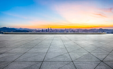 Fototapeta premium Empty square floor and city skyline with mountain scenery in Shenzhen
