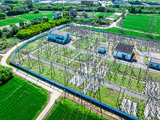 Aerial view of substation power tower equipment landscape