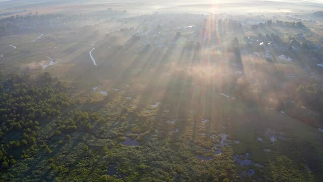 4k drone flying over footage (Ultra High Definition) of flooded valley. Misty morning scene of snake shape Seret river. Wonderful summer view of Ternopil countryside, Ukraine, Europe.