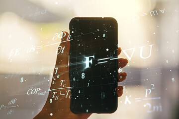 Creative scientific formula concept and hand with phone on background. Multiexposure