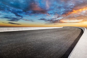 Empty asphalt road and sky clouds background