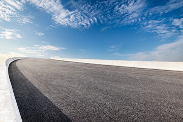 Empty asphalt road and sky clouds background