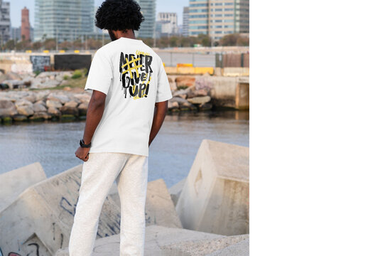 Mockup of man wearing customized t-shirt by water