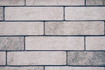 The wall is light-colored brick with space for copying. Layout for your design. High quality photo