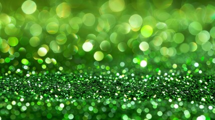 Obraz premium A green background adorned with myriad small circles of light, overlain by a glittery, green backdrop