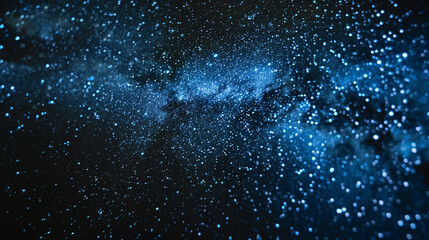 A dark background with tiny blue and white dots forming a starry sky.