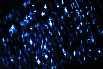 Abstract dark background with navy blue and white stars