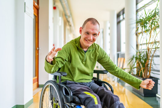 Man with disability happy in the corridor of the university