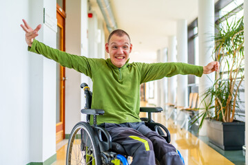 Man with cerebral palsy celebrating he is in the university