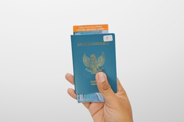 a hand of man hold indonesia  passport
