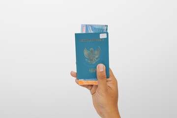a hand of man hold indonesia  passport