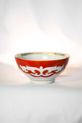 Kazakh piala. Central Asia traditional tea cup with national ornament. National red bowl isolated on white background