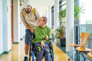 Man and friend with disability around the university