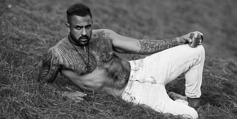 Latin Man in grass farm. Ecology concept. Sexy Farmer with bare naked torso. Muscular sexy Farmer...