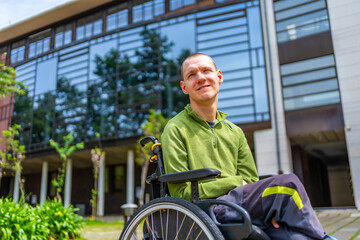 Man with physical disability in wheelchair outside the university