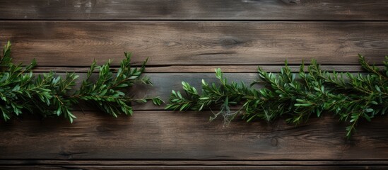 Top view of Christmas fir branches decorated on an old wooden background creating a visually appealing copy space image