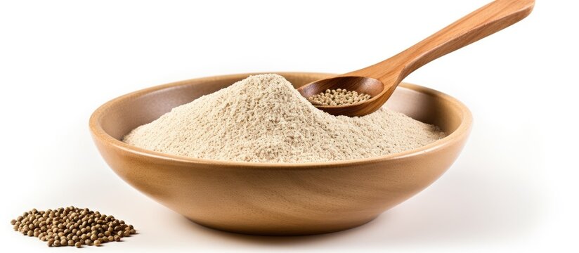 Raw fonio seeds in a bowl with a spoon on white background close up Alternative flour. copy space available