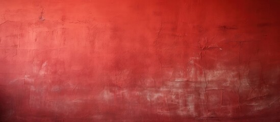 Fototapeta premium A textured crimson wall serves as the background with various shades of the same red hue providing a visually interesting copy space image