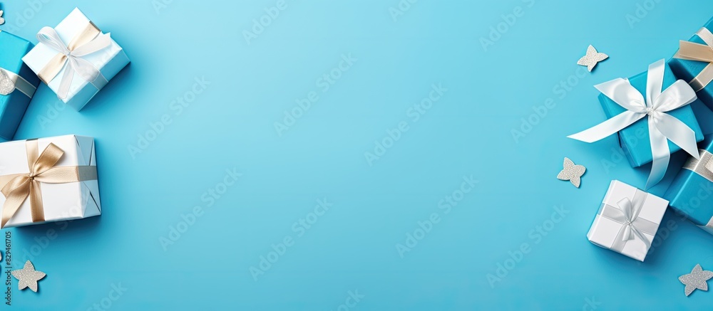 Poster Flat lay composition with gift boxes on blue background space for text Greeting card. copy space available