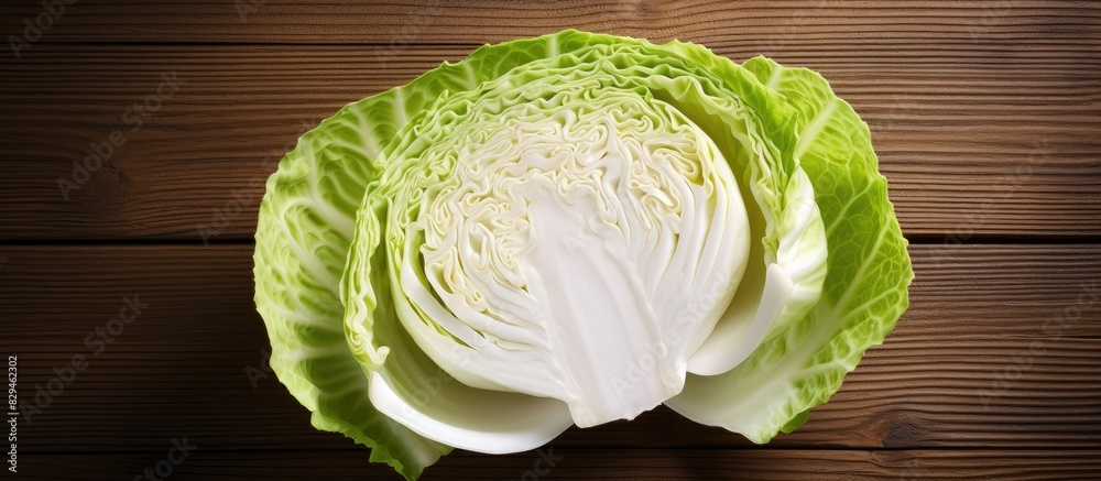 Poster Raw sliced Pointed white cabbage Wooden background Top view Copy space