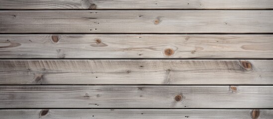 Fototapeta premium Wood texture as background Grey and beige boards with knots coming from natural tree Wooden panel has beautiful light pattern. copy space available