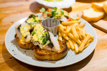 Grill fish on the toast with French fry in the restaurant