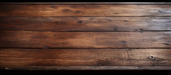 Obraz premium A worn and rustic wooden table with a textured surface perfect for use as a background or for displaying objects copy space image