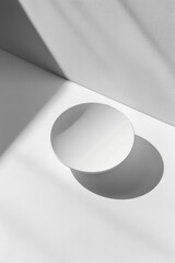 A simple, clean white background with a single, modern element like a perfectly round shadow 