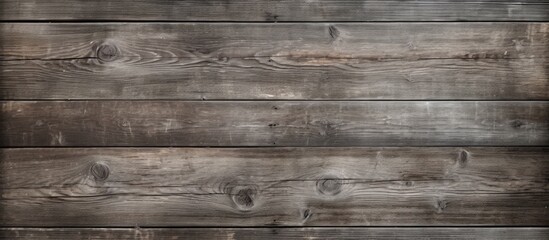 Naklejka premium An abandoned and grungy gray wood texture background with dry cracked and aged wood planks providing a copy space image