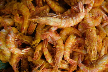 Delicious fried sea prawns on a container. Shrimp or prawns is a variety of seafood. Indonesian food.