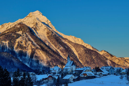 Alpenglowing Kleiner Priel with town in Vorderstoder, Totes Gebirge, Upper Austria, Austria