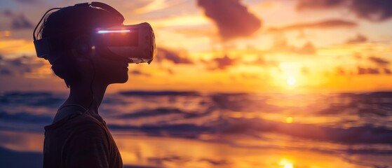 Silhouette of a person wearing VR headset, gazing at a sunset over the ocean.