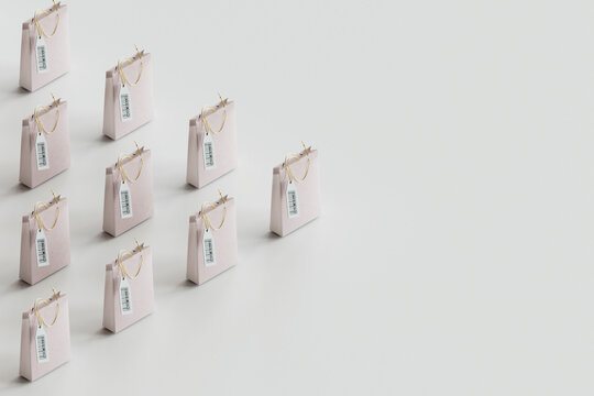 Shopping bags in row against gray background