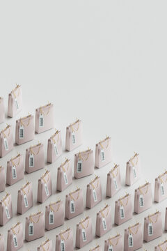 Shopping bags with labels kept in row over gray background